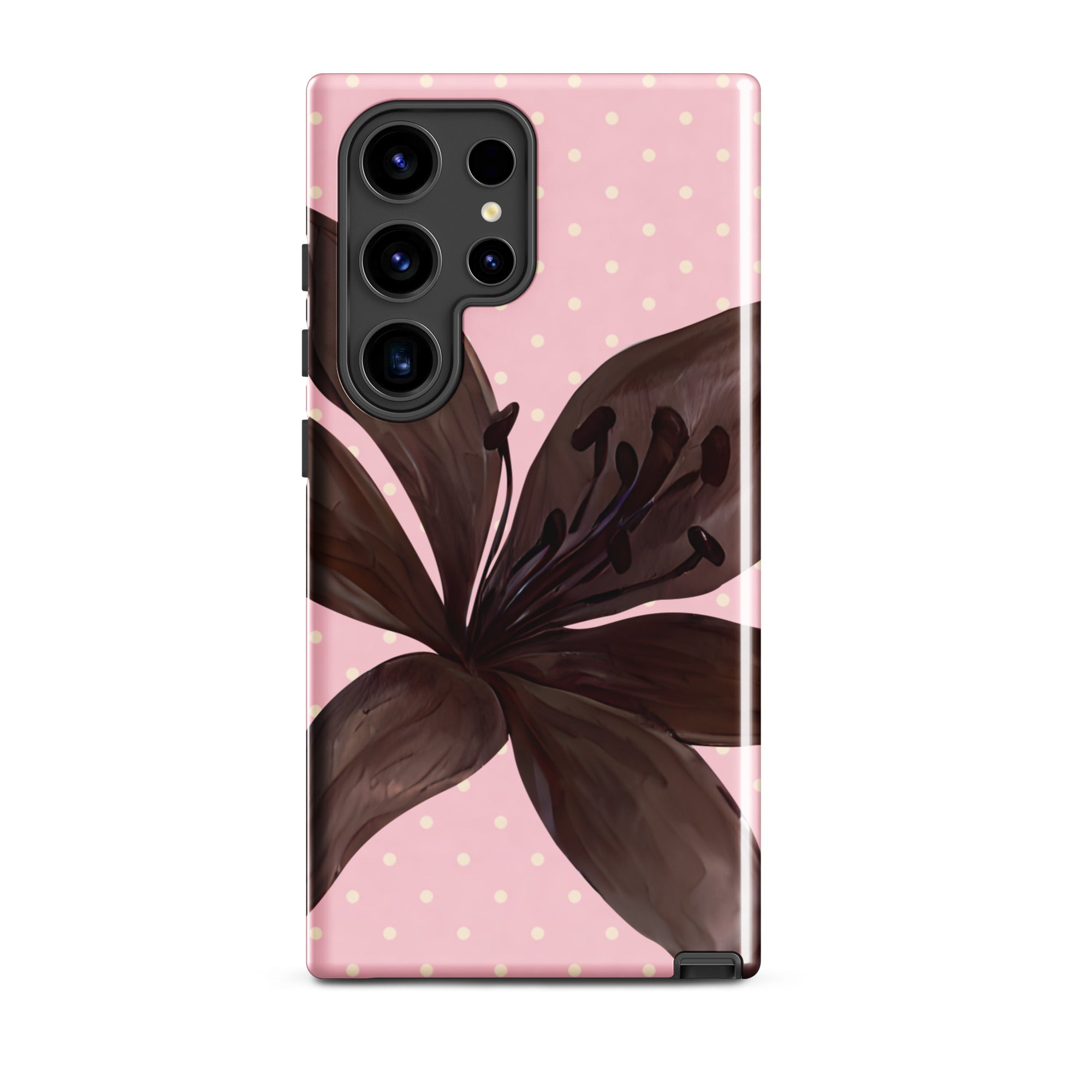 Phone case with brown flower design on a pink polka dot background